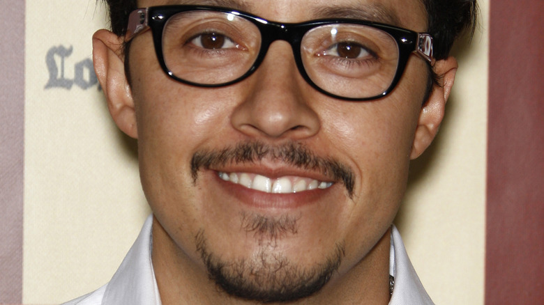 Efren Ramirez wearing glasses and smiling