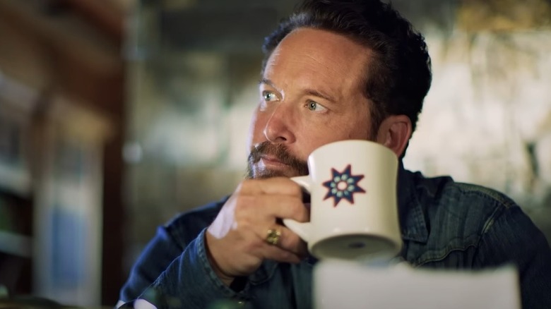 Cole Hauser drinking coffee in a Free Rein commercial