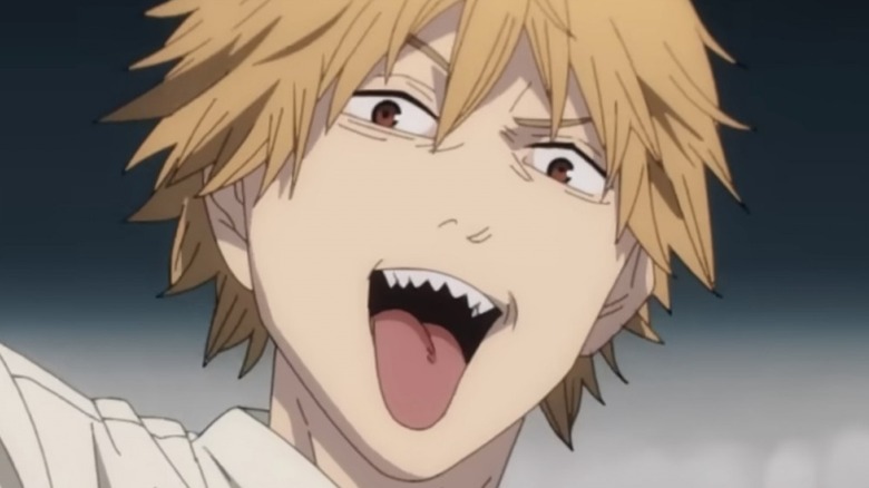 Denji sticking his tongue out while battling a devil