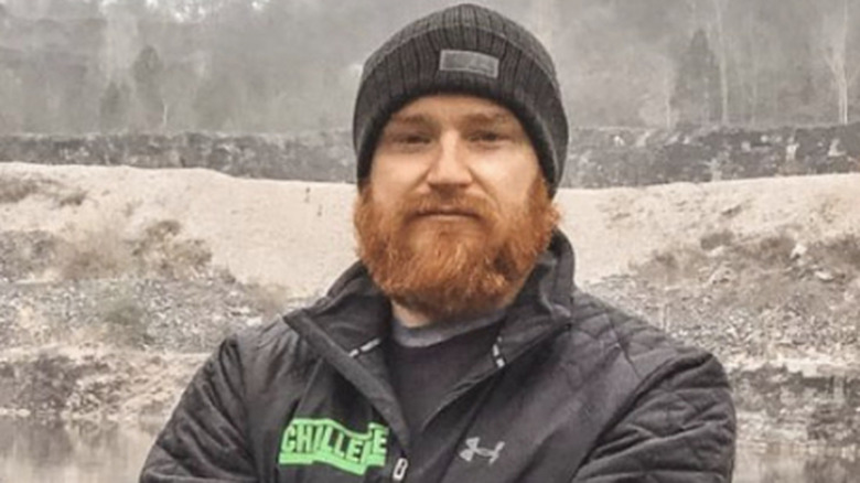 Wes standing by a lake