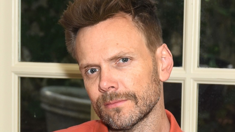 Joel McHale looking into camera