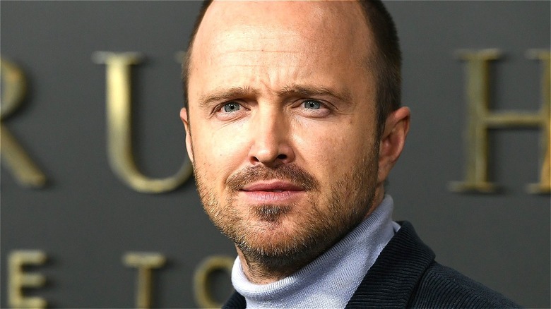 Aaron Paul smiling on red carpet 