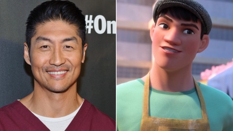 Brian Tee smiling in scrubs