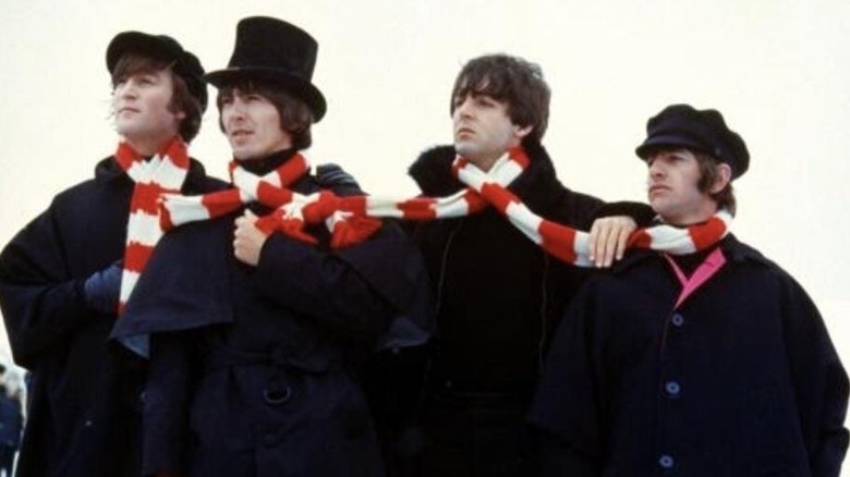 The Beatles wearing one striped scarf in 