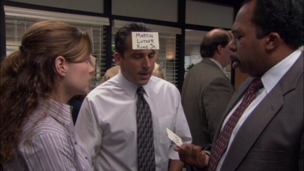 Pam (Jenna Fischer) and Stanley (Leslie David Baker) get advice from Michael (Steve Carell) on The Office