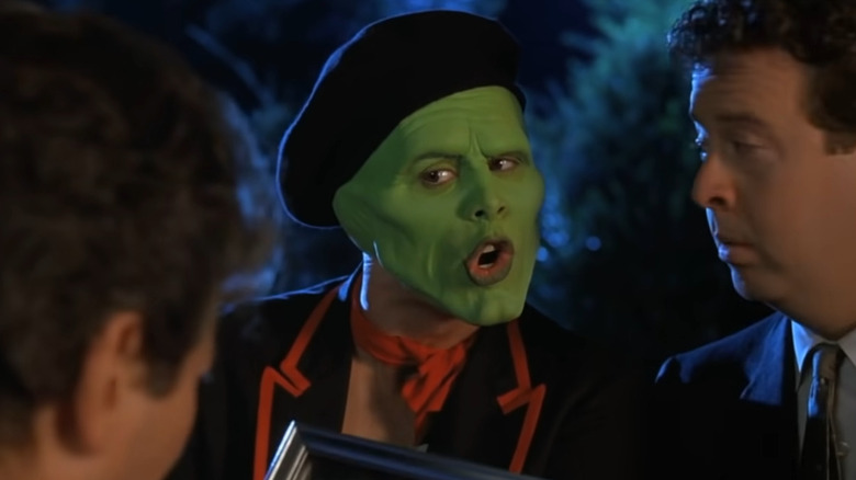 The Mask and Doyle looking in the Mask's pockets