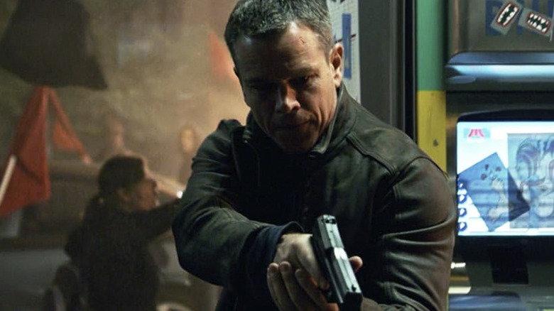 Jason Bourne holds a gun and looks at someone off camera in 2016's "Jason Bourne"