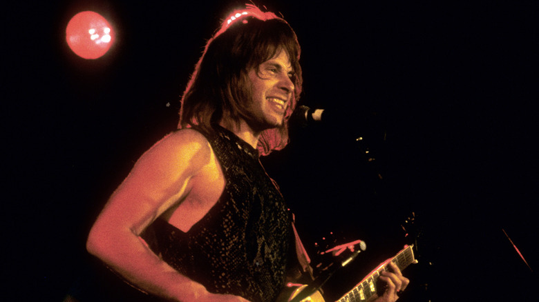 Nigel playing guitar on stage on This Is Spinal Tap (1984)l