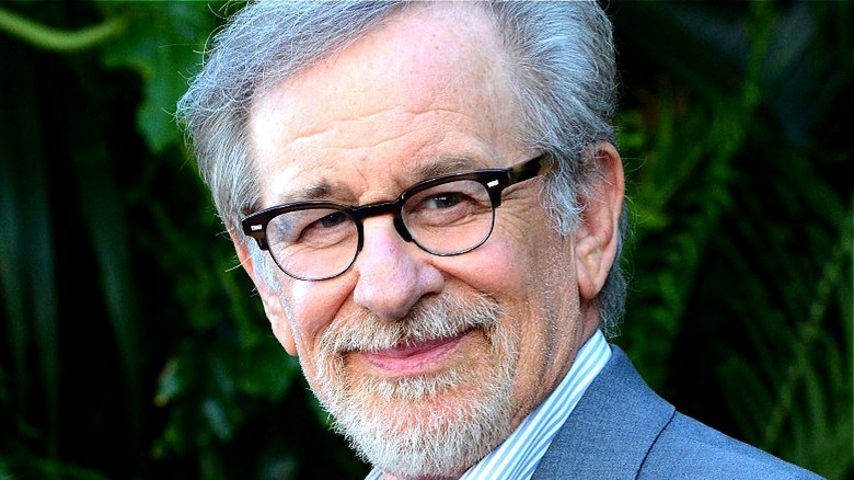 Steven Spielberg smiling at the camera