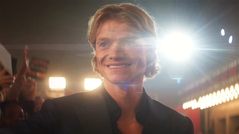 Matt Hagen smiling surrounded by fans in 