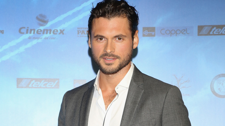 Adan Canto smiles