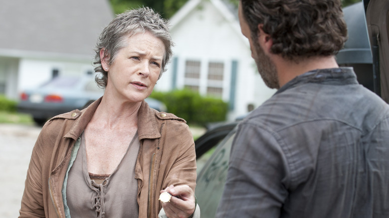 Carol giving Rick her watch
