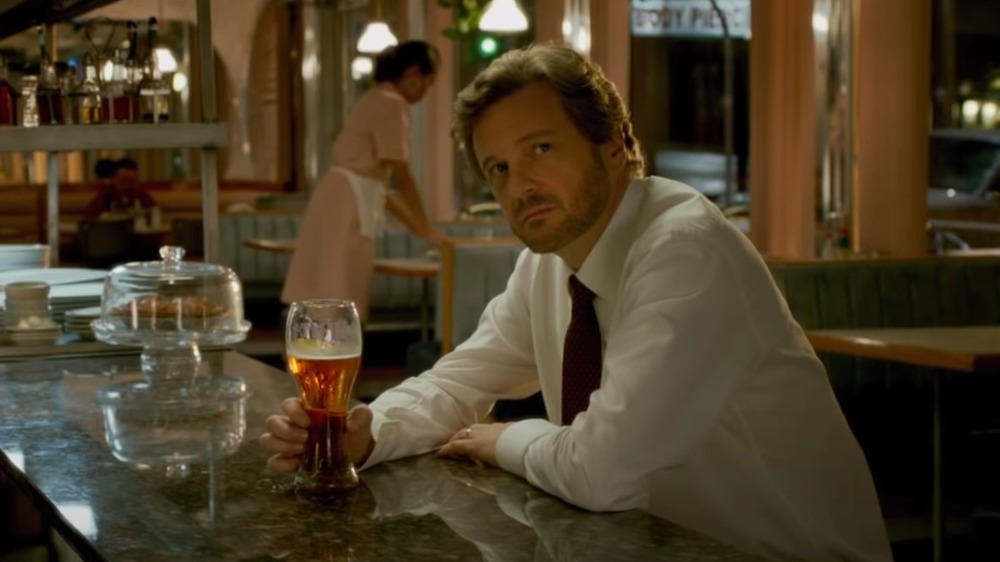 Colin Firth drinking beer