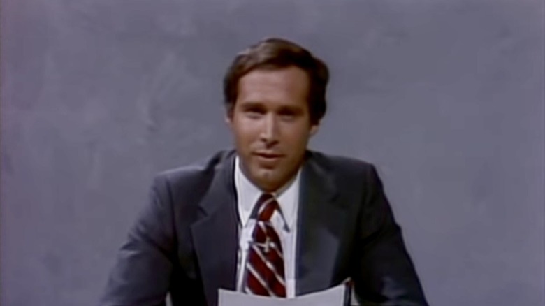 Chase anchors in front of gray background