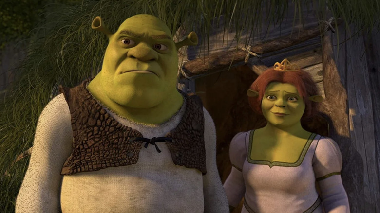 Shrek and Fiona outside cottage