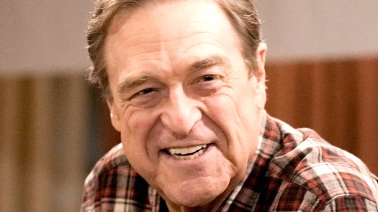 John Goodman as Dan Conner smiling