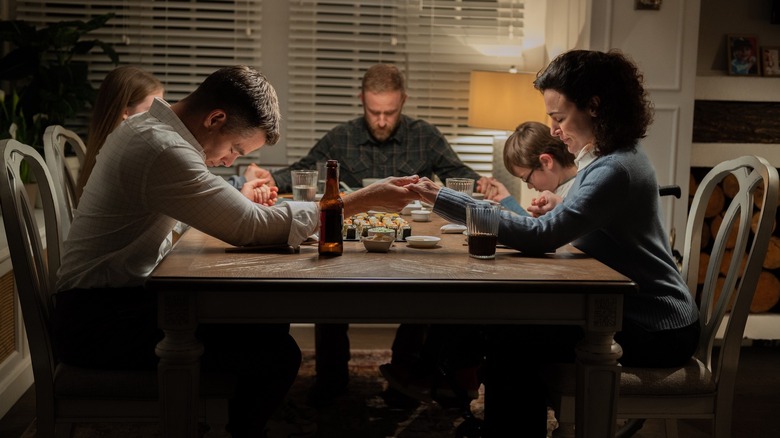 James Harper having dinner with Mike Denton's family