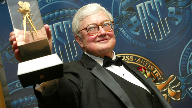 Roger Ebert holding trophy