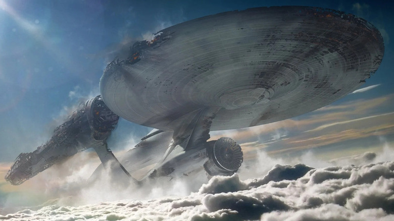 The Enterprise rises through the clouds in 