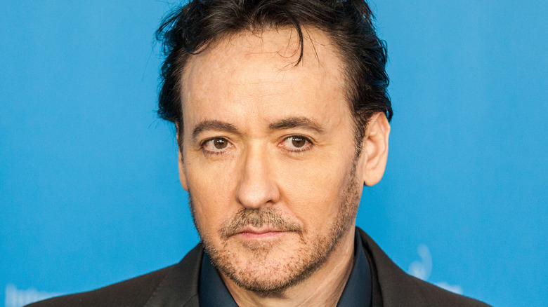 John Cusack staring