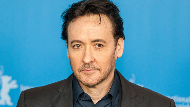John Cusack staring