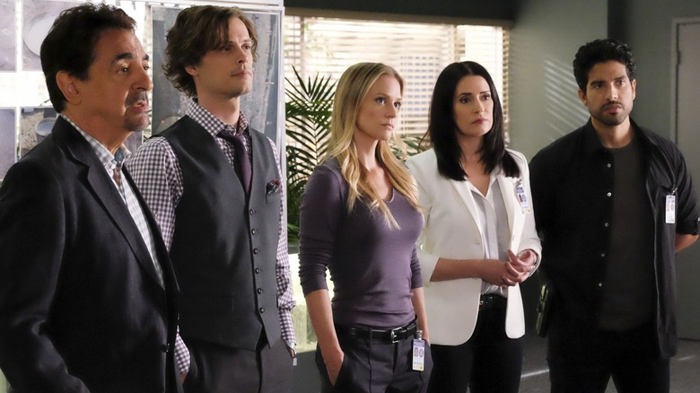 The Criminal Minds team stands in office