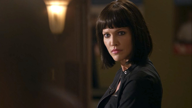 Tricia Helfer wearing black jacket