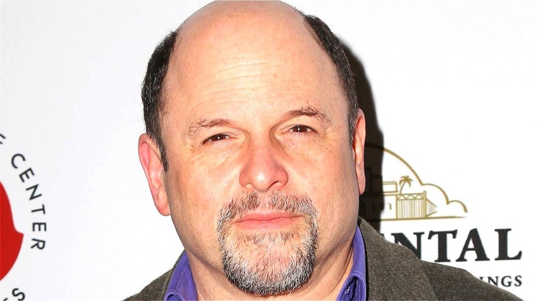 Jason Alexander posing for pictures