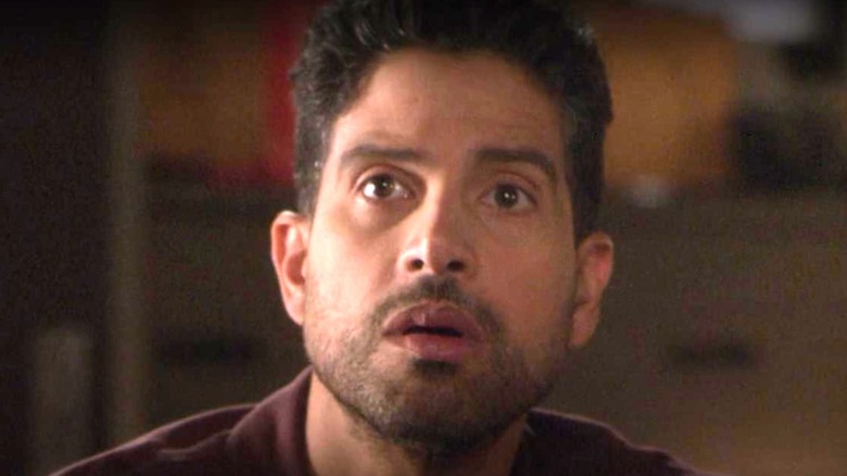 Adam Rodriguez looking up