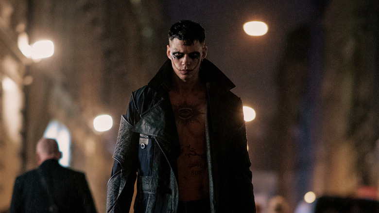 Eric in makeup and long coat