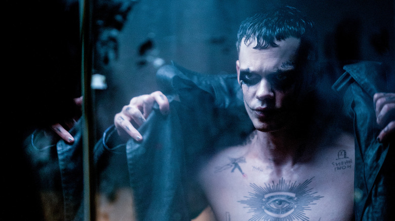 The Crow's Bill Skarsgard scowling in mirror