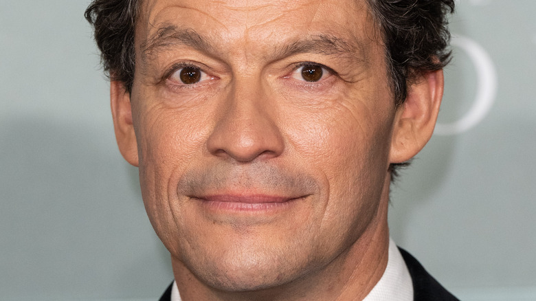 Dominic West smiles