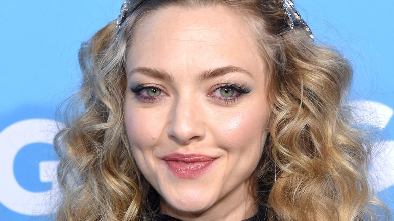 Amanda Seyfried smiling with mouth closed
