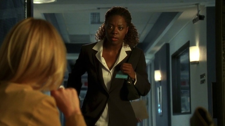 Ms. Campbell standing at Catherine Willows' office door