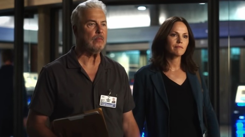 Gil Grissom and Sara Sidle standing together