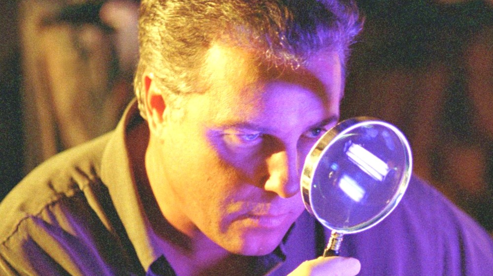 William Petersen with magnifying glass