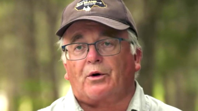 Charles Barkhouse searching for treasure