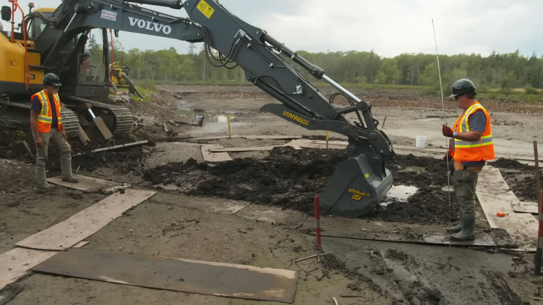 Oak Island team using excavator