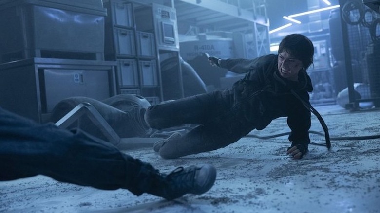 Joey slides across the floor with a knife in Cleaner (2025)