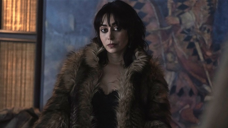 Sofia wearing big fur coat in 