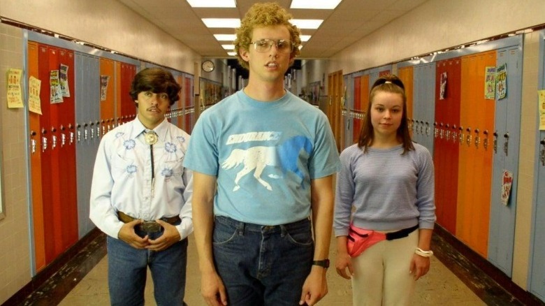 Pedro, Napoleon, and Deb walk down the hall at school