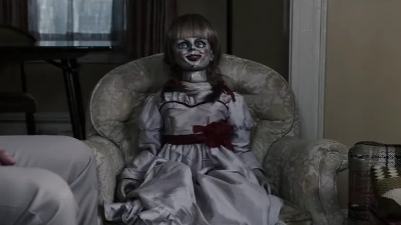 Annabelle staring from chair