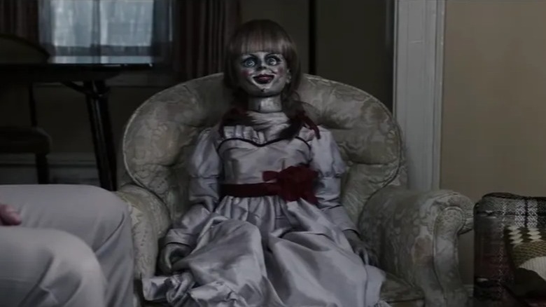 Annabelle staring from chair