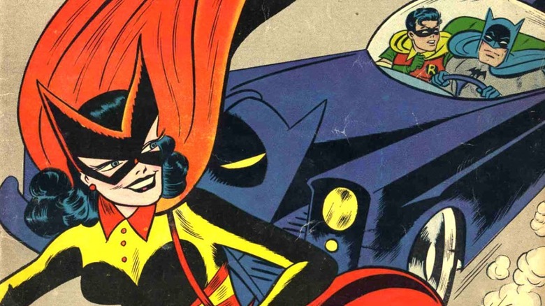 Batwoman escapes Batman on motorcycle