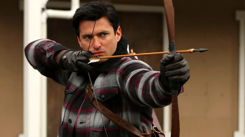 Gaston shooting arrow