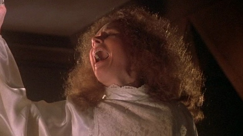 Margaret White with knife through hand