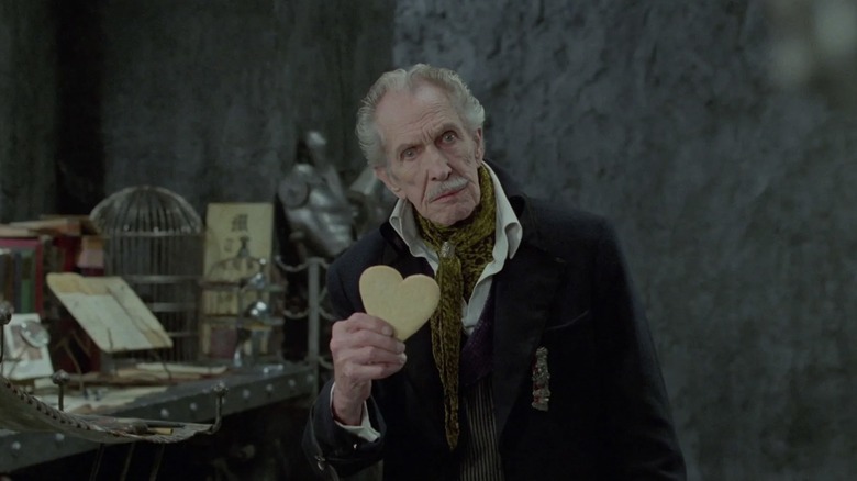 The Inventor holding a cookie