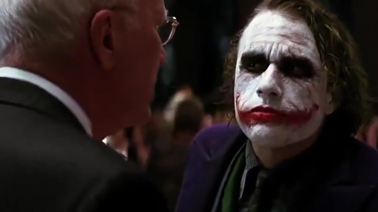 Joker attacking party guest
