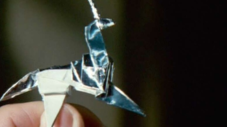 Deckard holds origami unicorn in Blade Runner