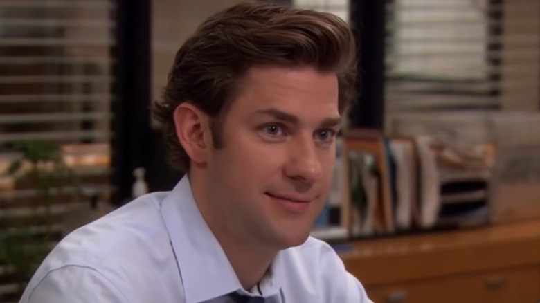 Jim Halpert smiling at desk